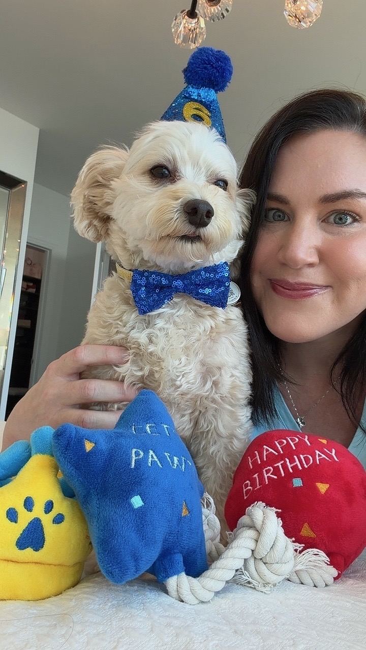 Jen with Cooper in his birthday hat and bow tie